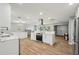 Open concept kitchen with white cabinets, marble countertops and stainless steel appliances at 6010 Bayou Grande Ne Blvd, St Petersburg, FL 33703