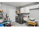 Well-equipped laundry room with modern washer and dryer, cabinets, and a utility sink at 6010 Bayou Grande Ne Blvd, St Petersburg, FL 33703