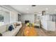 Bright living room featuring a comfortable sofa and seamless flow into the kitchen at 6010 Bayou Grande Ne Blvd, St Petersburg, FL 33703