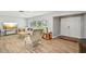 Open-concept living area featuring wood-look tile floors and neutral tones at 6010 Bayou Grande Ne Blvd, St Petersburg, FL 33703