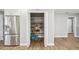 Walk-in pantry with shelves and adjacent stainless steel refrigerator and dining area at 6010 Bayou Grande Ne Blvd, St Petersburg, FL 33703