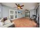 Comfortable sunroom with tiled floors, ceiling fans, and great natural light at 6010 Bayou Grande Ne Blvd, St Petersburg, FL 33703