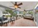Spacious sunroom with tiled floors, ceiling fans, and comfortable seating, perfect for relaxing and entertaining at 6010 Bayou Grande Ne Blvd, St Petersburg, FL 33703