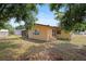 Backyard with screened in porch and storage shed at 6109 16Th St, Zephyrhills, FL 33542