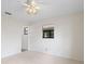 Bright bedroom with a window and a door leading to a closet, offering ample space and natural light at 6109 16Th St, Zephyrhills, FL 33542