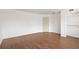 Spacious bedroom featuring wood-look flooring and a closet for storage solutions at 6109 16Th St, Zephyrhills, FL 33542
