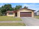 Charming home featuring a one car garage, beautiful stone accents, and well-maintained lawn at 6109 16Th St, Zephyrhills, FL 33542