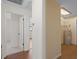 Hallway view with doorways leading to various rooms and a utility area featuring a water heater at 6109 16Th St, Zephyrhills, FL 33542