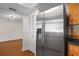 The kitchen shows stainless steel appliances, wood cabinets, and tile flooring at 6109 16Th St, Zephyrhills, FL 33542
