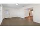 Open-concept living area with tile flooring and a doorway leading to another room, maximizing space at 6109 16Th St, Zephyrhills, FL 33542
