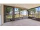 Outdoor patio featuring views of storage shed and an exterior pet door at 6109 16Th St, Zephyrhills, FL 33542
