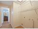Utility room with water hookups, a small window, and doorway to an adjacent bathroom at 6109 16Th St, Zephyrhills, FL 33542