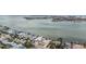 Sweeping aerial view of waterfront homes, featuring private docks, lush landscaping, and tranquil, open bay waters at 7092 S Shore S Dr, St Petersburg, FL 33707