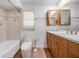 Full bathroom featuring a wooden cabinet vanity and matching fixtures at 7092 S Shore S Dr, St Petersburg, FL 33707