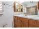 Full bathroom featuring a cabinet vanity with white countertops and bronze fixtures at 7092 S Shore S Dr, St Petersburg, FL 33707