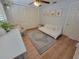 Bedroom features wood floors, ceiling fan, and ample closet space at 7092 S Shore S Dr, St Petersburg, FL 33707