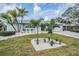 Well maintained single-story home featuring a lush tropical landscaped yard and a two-car garage at 7092 S Shore S Dr, St Petersburg, FL 33707
