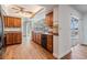 Spacious kitchen boasting wood cabinets, granite countertops, and views of the pool area at 7092 S Shore S Dr, St Petersburg, FL 33707