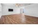 Open living area with wood flooring, neutral paint, and access to an outdoor patio at 7092 S Shore S Dr, St Petersburg, FL 33707