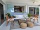 Comfortable outdoor patio area with stylish seating, stools, and easy access to the kitchen at 7092 S Shore S Dr, St Petersburg, FL 33707