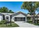 Charming single-story home with a two-car garage and mature landscaping at 7253 Cleopatra Dr, Land O Lakes, FL 34637