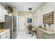 Well-equipped kitchen nook featuring stainless steel refrigerator and decorative accents at 7253 Cleopatra Dr, Land O Lakes, FL 34637