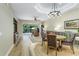 Bright living room with hardwood floors, comfortable seating, and natural light at 7253 Cleopatra Dr, Land O Lakes, FL 34637