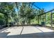 Empty screened patio providing ample space, ideal for customization and outdoor living at 7253 Cleopatra Dr, Land O Lakes, FL 34637