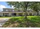 View of the condo backyard with a tree at 8612 Hunters Key Cir, Tampa, FL 33647