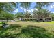 View of the condo backyard with a bench at 8612 Hunters Key Cir, Tampa, FL 33647
