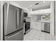 Modern kitchen featuring stainless steel appliances, white cabinets, and beautiful countertops at 8612 Hunters Key Cir, Tampa, FL 33647