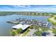 Picturesque aerial view of marina with numerous boats docked on calm water, surrounded by homes at 915 Tidewater Shores Loop, Bradenton, FL 34208