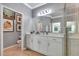 Spacious bathroom showcasing a vanity with elegant lighting, framed art, and a toilet in a calming setting at 915 Tidewater Shores Loop, Bradenton, FL 34208