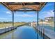This covered boat lift on a canal is ready for boating season at 915 Tidewater Shores Loop, Bradenton, FL 34208