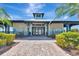 Elegant clubhouse entrance with manicured landscaping, creating an inviting community atmosphere at 915 Tidewater Shores Loop, Bradenton, FL 34208