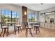Bright common area features high-top seating, bar, natural light, and an accent wall with stone design at 915 Tidewater Shores Loop, Bradenton, FL 34208