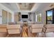 Community space with cozy chairs, a fireplace, and a large TV for relaxing and enjoying company at 915 Tidewater Shores Loop, Bradenton, FL 34208