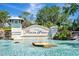 Scenic entrance to Tidewater Preserve with cascading water feature and lush tropical landscaping at 915 Tidewater Shores Loop, Bradenton, FL 34208