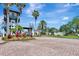 Community entrance with manicured landscaping and a decorative fountain, creating a grand welcome at 915 Tidewater Shores Loop, Bradenton, FL 34208