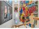 Foyer featuring bright artwork and a decorated door with glass, leading to a wood staircase at 915 Tidewater Shores Loop, Bradenton, FL 34208