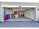 Spacious garage with ample storage, clean epoxy floors and convenient door access at 915 Tidewater Shores Loop, Bradenton, FL 34208