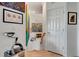 Hallway featuring stylish artwork and a staircase leading to the upper level, showcasing modern design at 915 Tidewater Shores Loop, Bradenton, FL 34208