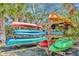 Assortment of kayaks stored on a wooden rack, ready for watersport adventures at 915 Tidewater Shores Loop, Bradenton, FL 34208