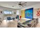 Spacious living room boasts water views, hardwood floors, modern art, and comfortable seating arrangements at 915 Tidewater Shores Loop, Bradenton, FL 34208