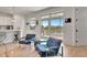 Bright living room with water views and balcony access from a wall of glass doors at 915 Tidewater Shores Loop, Bradenton, FL 34208