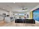 Bright, open-concept living area features a kitchen, dining area, and views overlooking the waterfront at 915 Tidewater Shores Loop, Bradenton, FL 34208