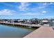 Scenic marina view featuring well-maintained docks and various boats under a bright, clear sky at 915 Tidewater Shores Loop, Bradenton, FL 34208