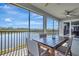 Enjoy the expansive lake views from this screened-in patio with a dining table for outdoor dining at 915 Tidewater Shores Loop, Bradenton, FL 34208