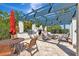 Outdoor patio with seating, pergola, built-in grill, bar, and views of landscaping at 915 Tidewater Shores Loop, Bradenton, FL 34208