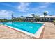 Resort-style pool with lane markers, surrounded by a paver deck and sun loungers at 915 Tidewater Shores Loop, Bradenton, FL 34208